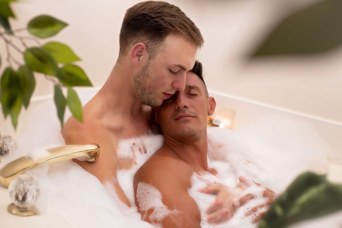 two men taking a bubble bath together