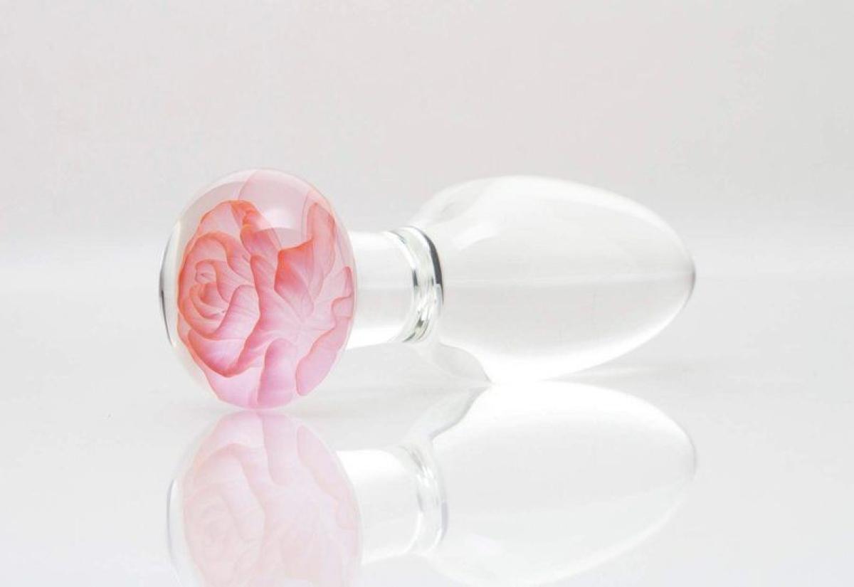 Clear glass butt plug with a pink glass rose base